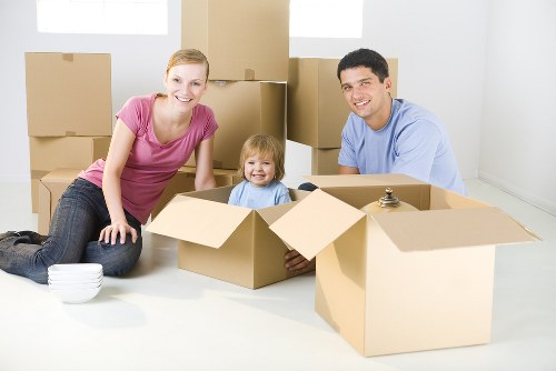 Removal team handling household items during a booked Strand Removals service