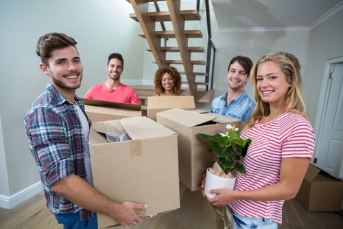 Removal team loading boxes for a move in Strand