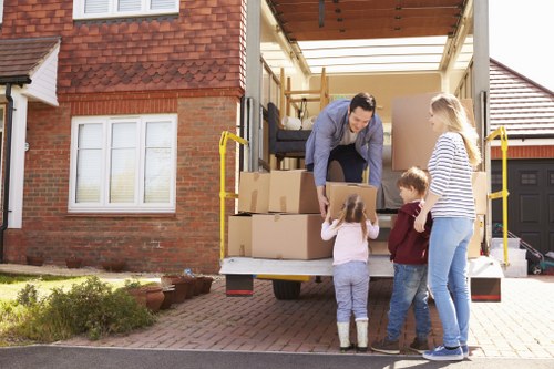 Man with a van service in Strand loading household furniture