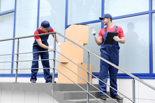 Removal staff using protective equipment during a move