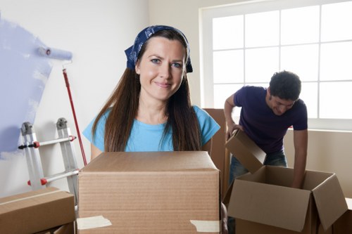 Moving crew wearing PPE and using protective equipment