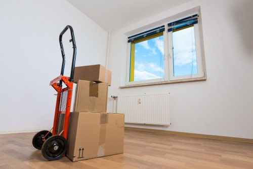 Careful packing materials and labeled boxes used for moving services in Strand