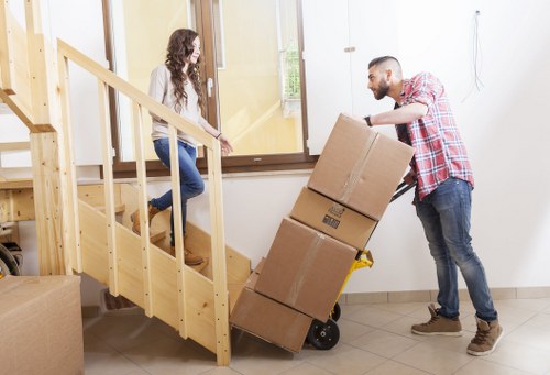 Packed moving boxes and furniture prepared for collection under removal terms