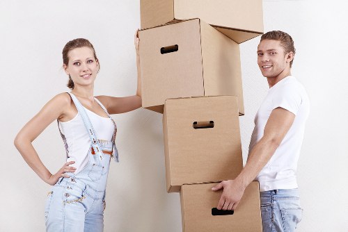 Removal team handling furniture during a Strand flat move