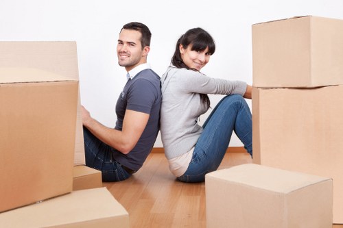 Moving team loading furniture during removal services in Strand